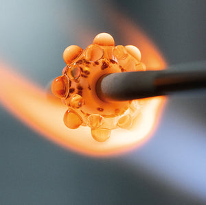 Trollbeads Glass beads in the making in a red hot flame